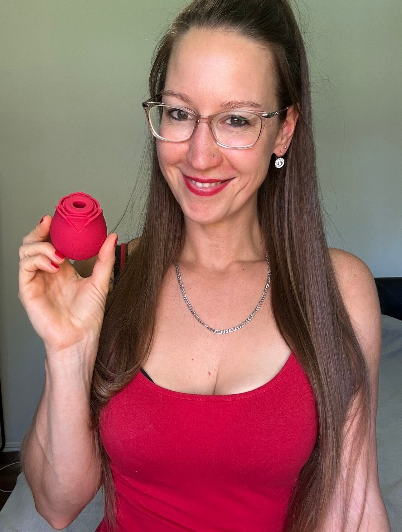 Pleasure Toy Queen Patricia holding the rose vibrator