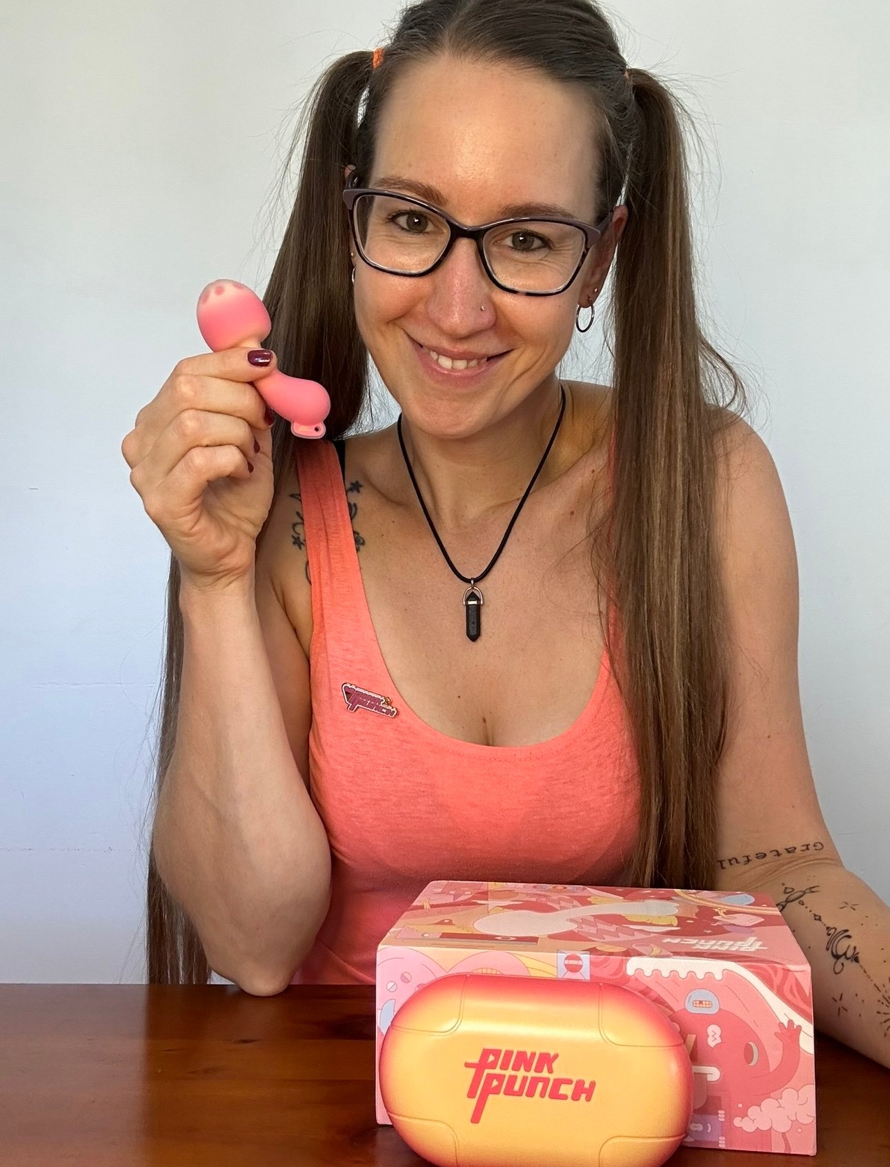 Pleasure Toy Queen Patricia holding the pinkpunch mushroom vibrator