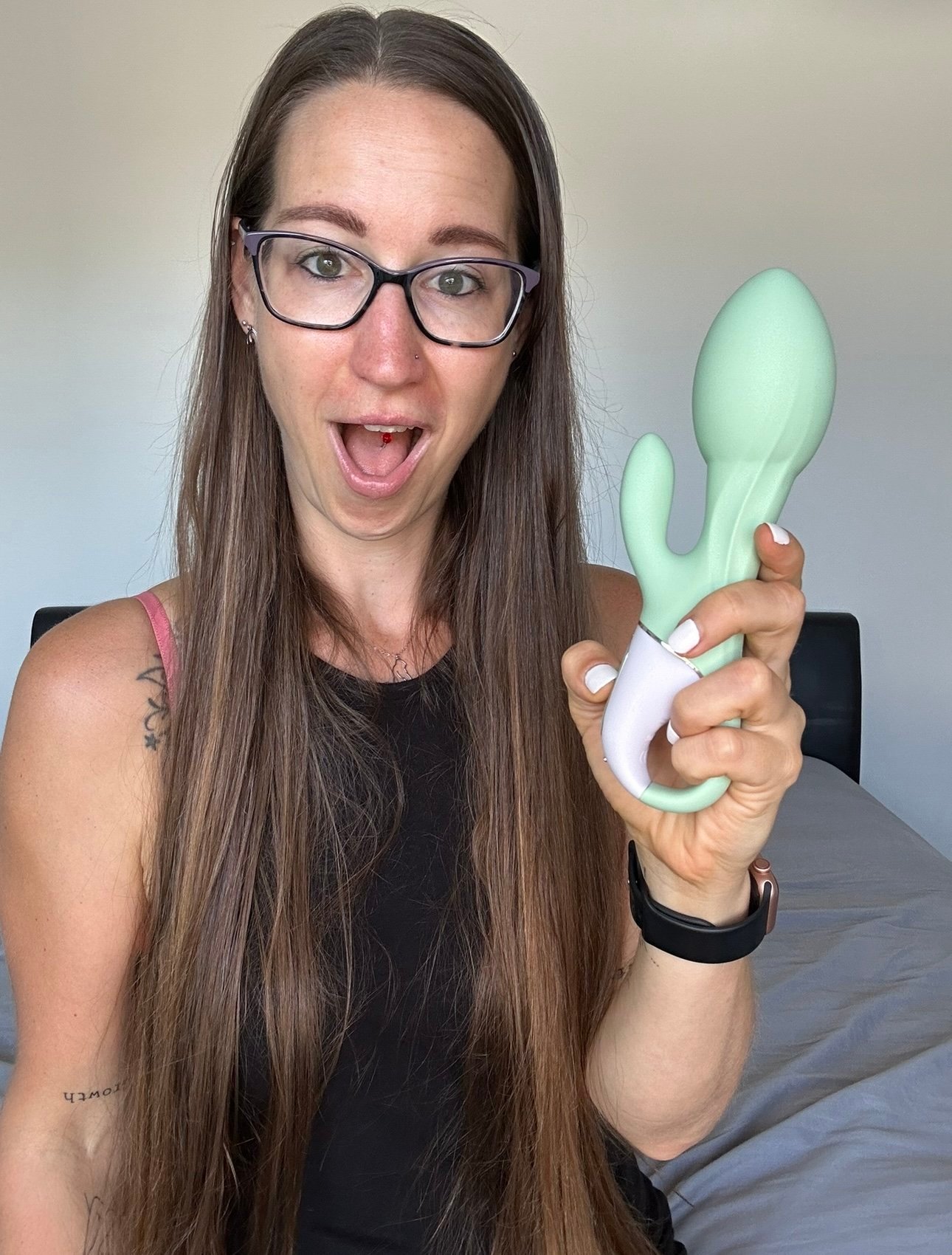 Pleasure Toy Queen Patricia holding a blow up vibrator