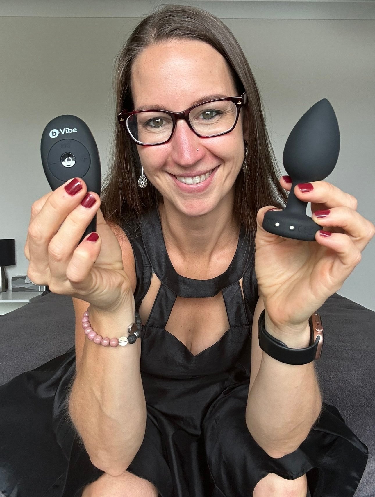 Pleasure Toy Queen Patricia holding the black jewel butt plug vibrator