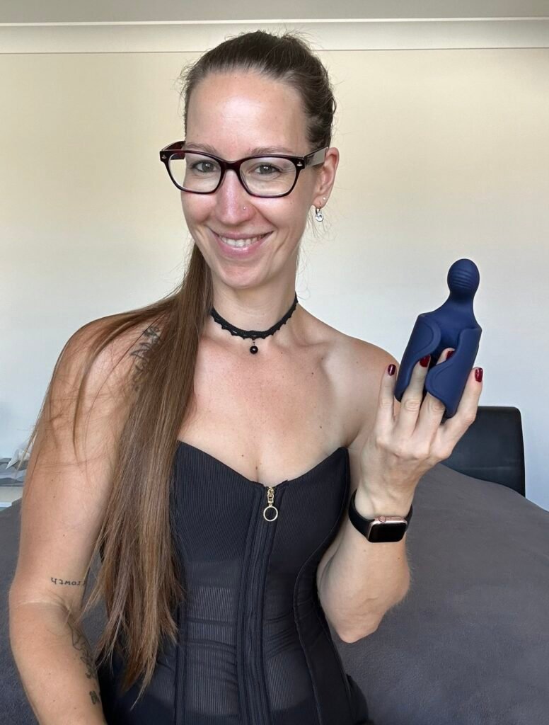 Pleasure Toy Queen Patricia holding the masturbation sleeve