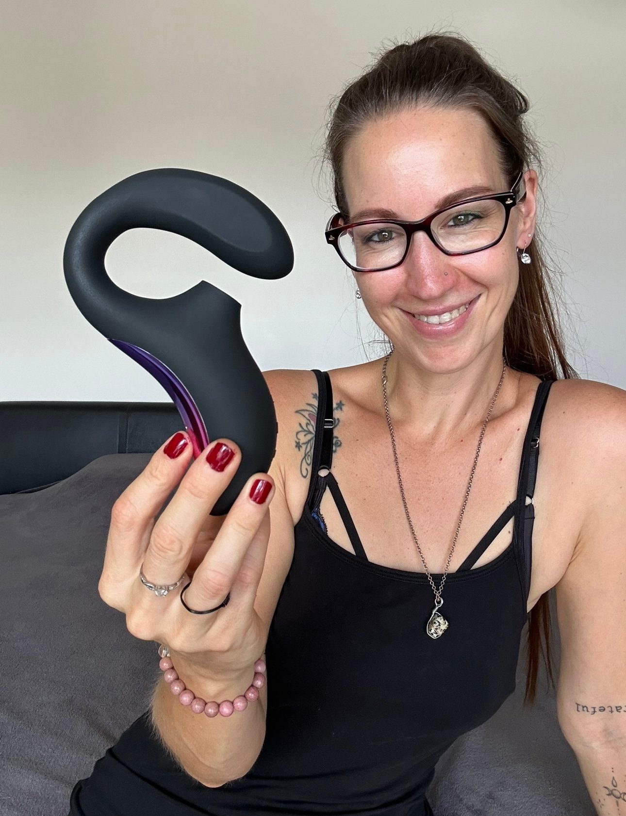 Pleasure Toy Queen Patricia holding the LELO Enigma