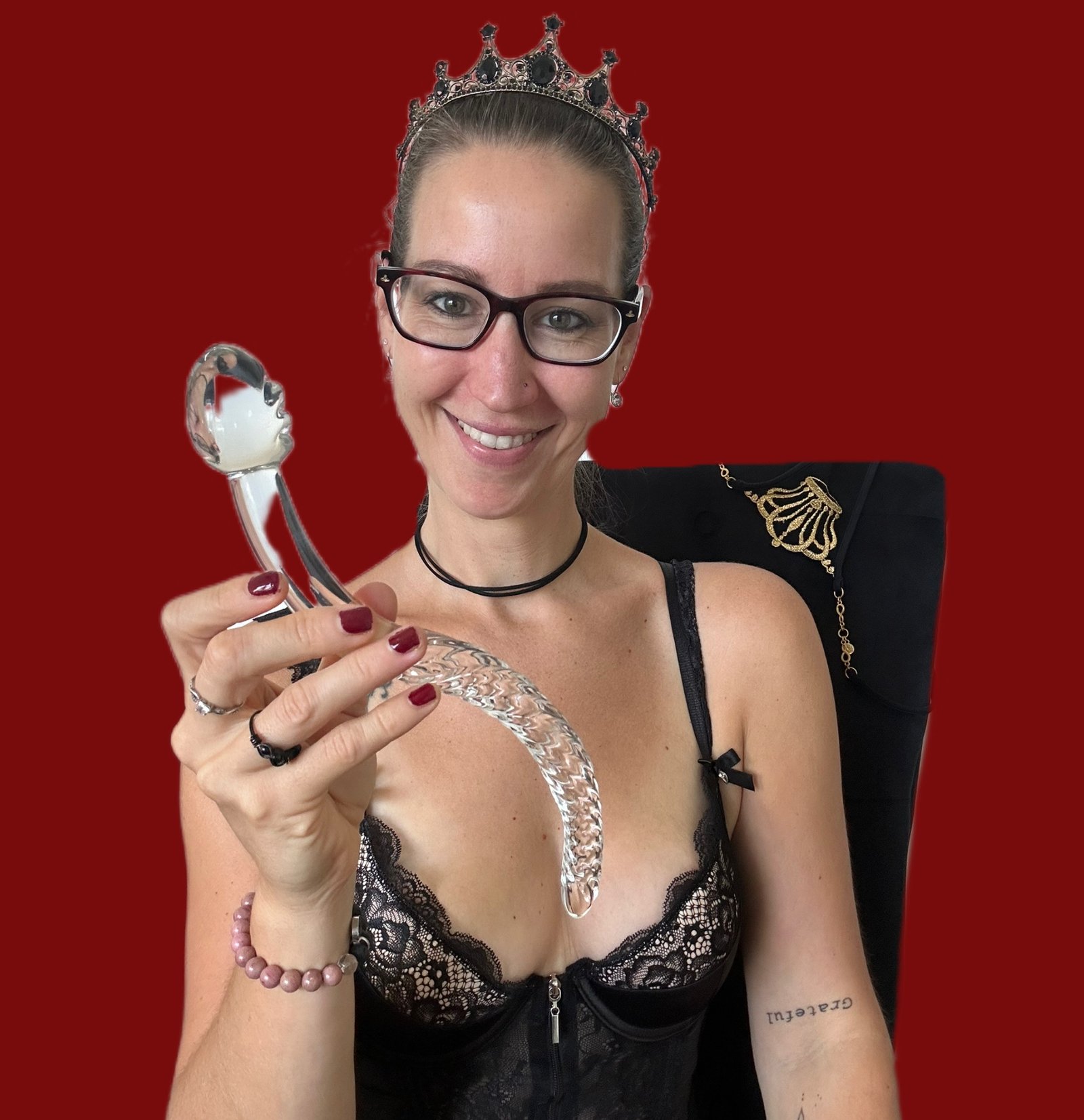 Pleasure Toy Queen Patricia holding the pleasure glass wand