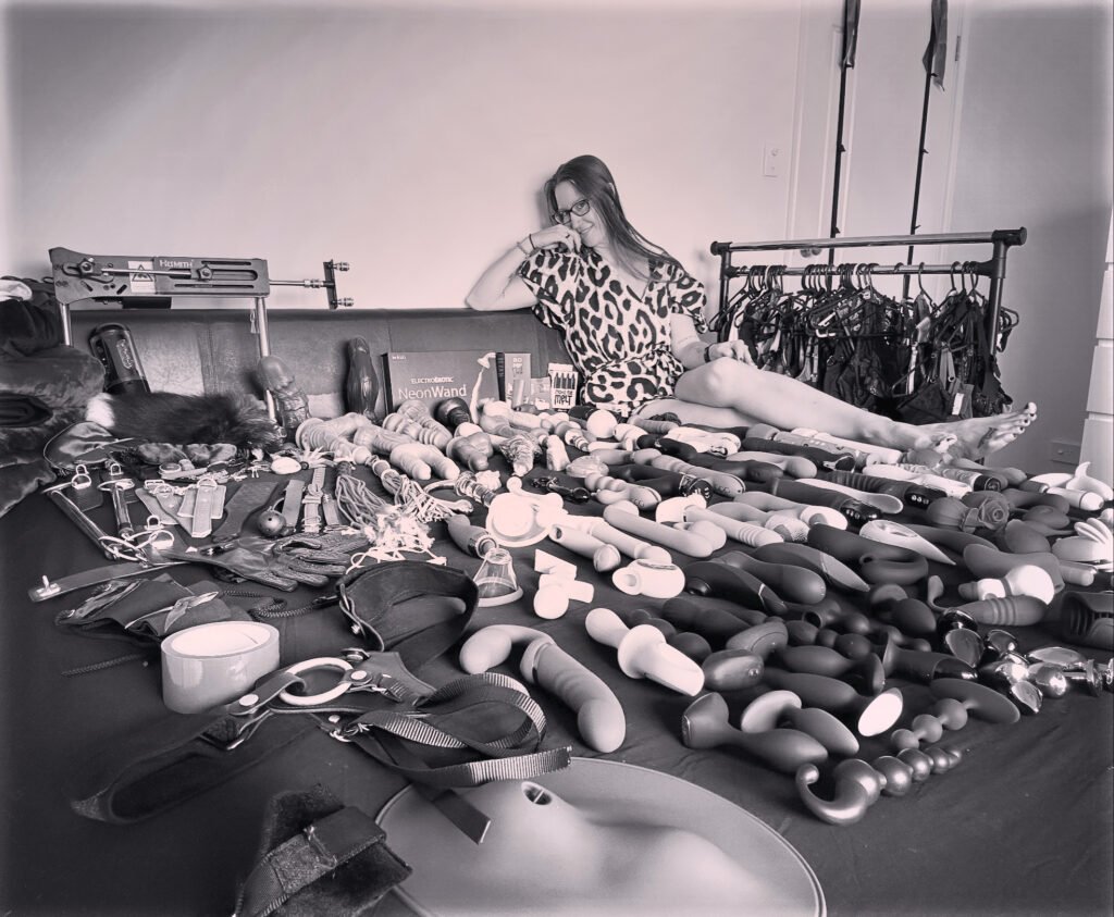 Pleasure Toy Queen Patricia with her 300+ pleasure toys and kinky tools collection.