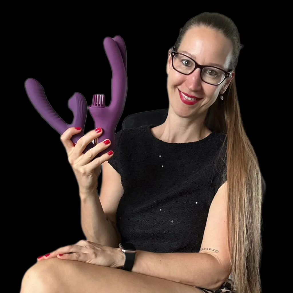 Pleasure & Toy Queen Patricia holding the Beta and Elatia rabbit vibrator