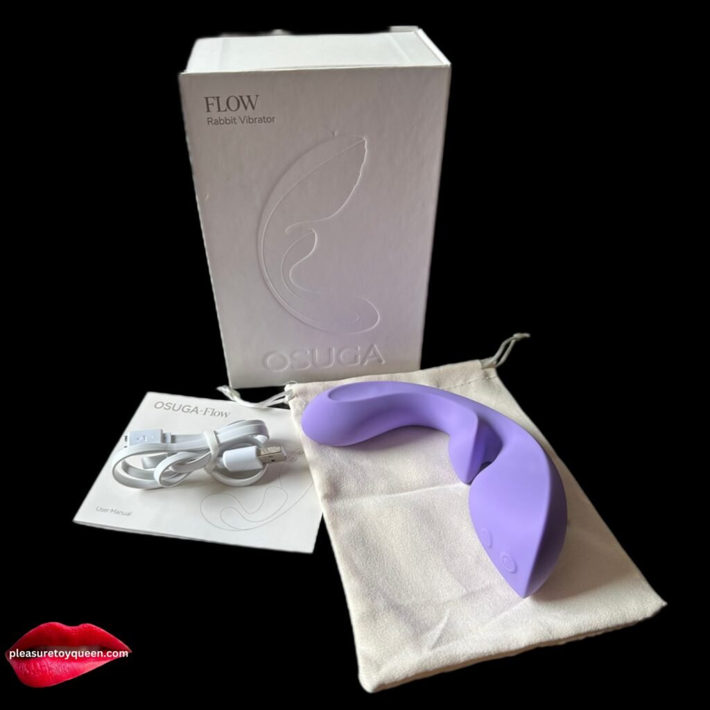 OSUGA Flow triple stimulation vibrator in purple with its box, cable and storage bag.