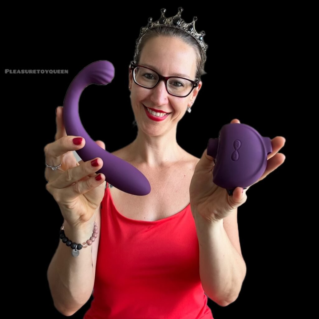 Pleasure & Toy Queen Patricia holding the Tracy's Dog OG3 dual stimulation pleasure toy. 